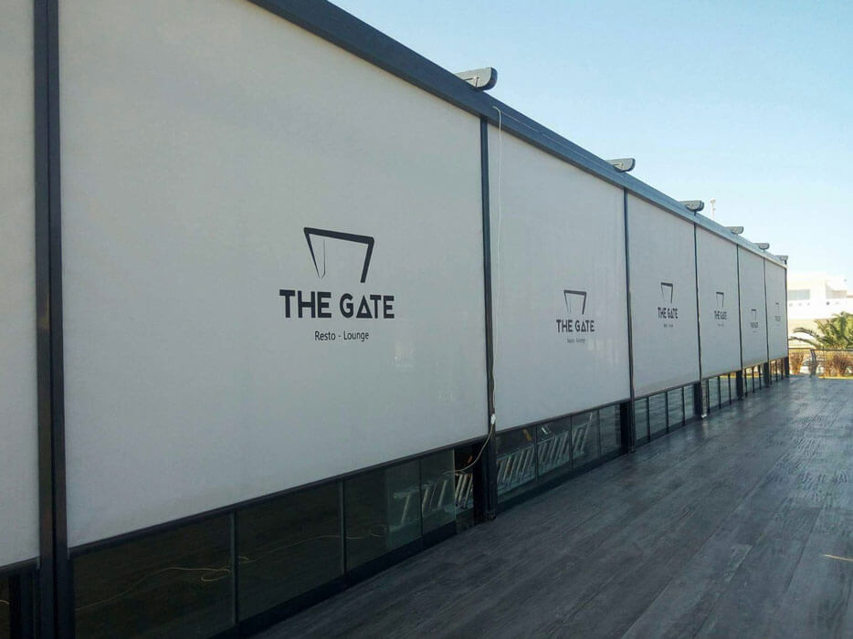 custom pergola shade system with company branding