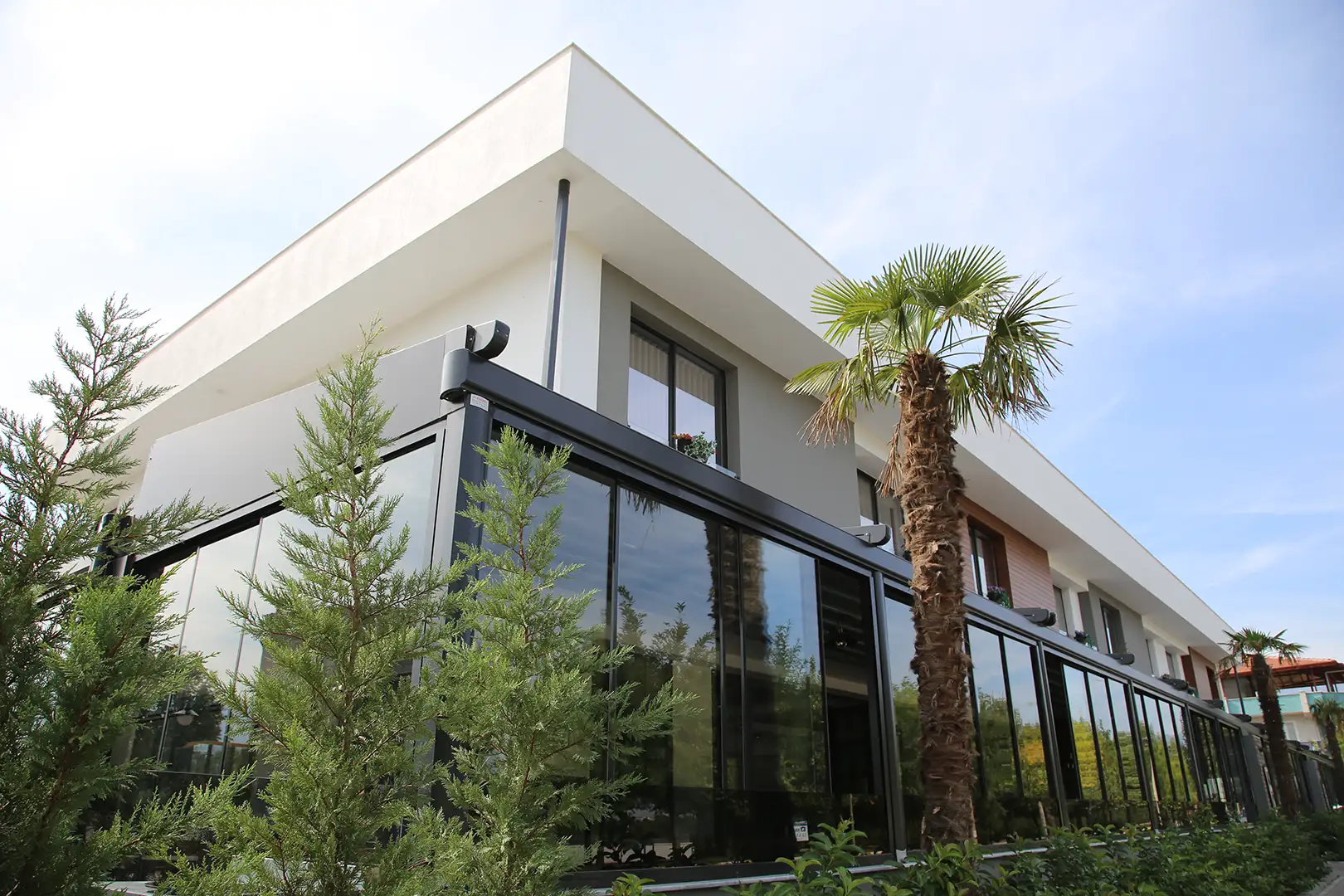 commercial pergola system wrap around building with Bora glass system