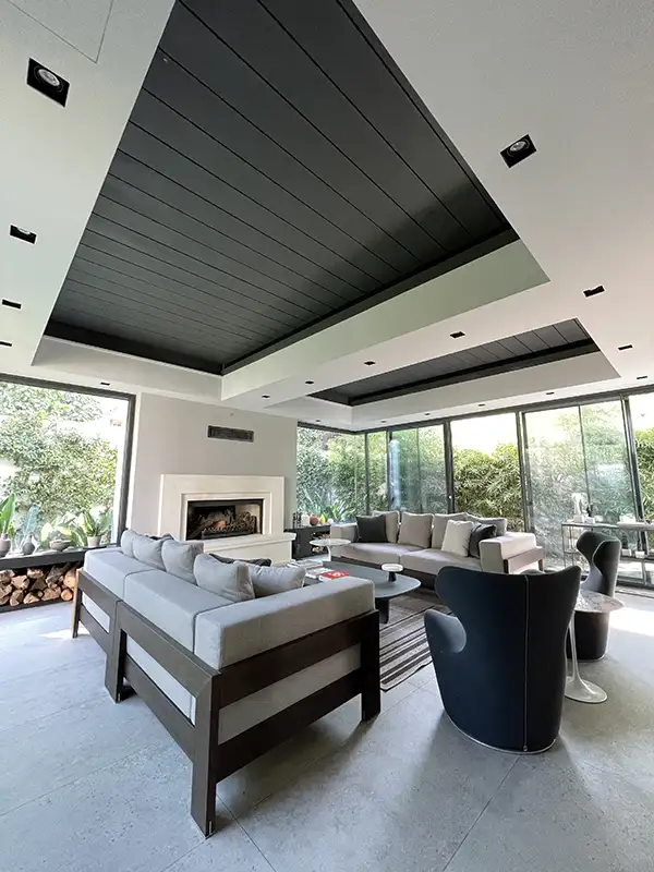 sunroom style pergola system with closed roof panels